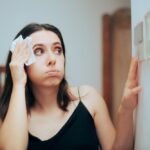 Woman,Felling,Hot,During,Summer,Setting,Her,Thermostat.,Person,Adjusting